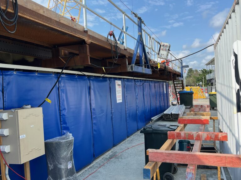 Blue AcousTech Sonic Acoustic Curtains, on a Brisbane bridge for noise control.