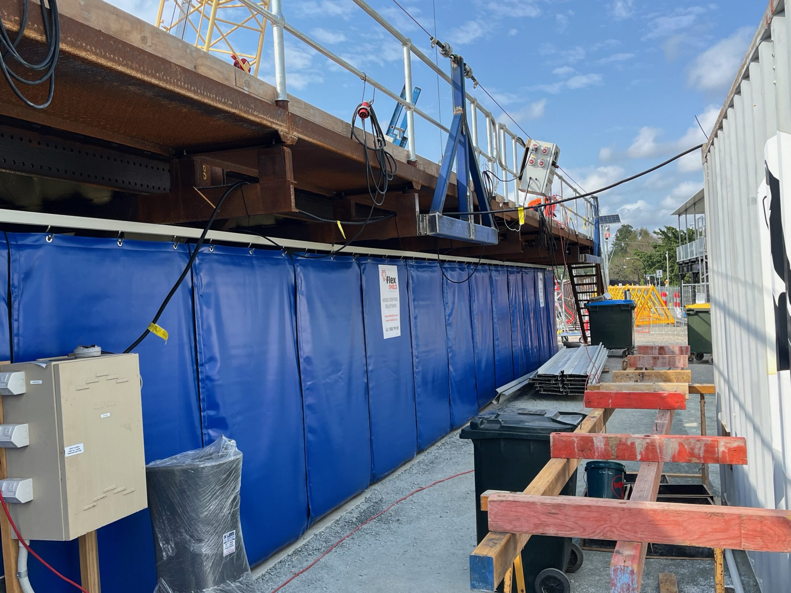 Blue AcousTech Sonic Acoustic Curtains, on a Brisbane bridge for noise control.