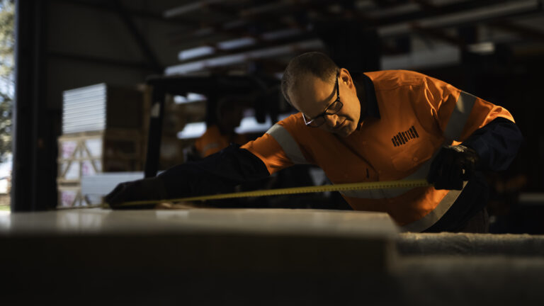 AcousTech team member measuring items