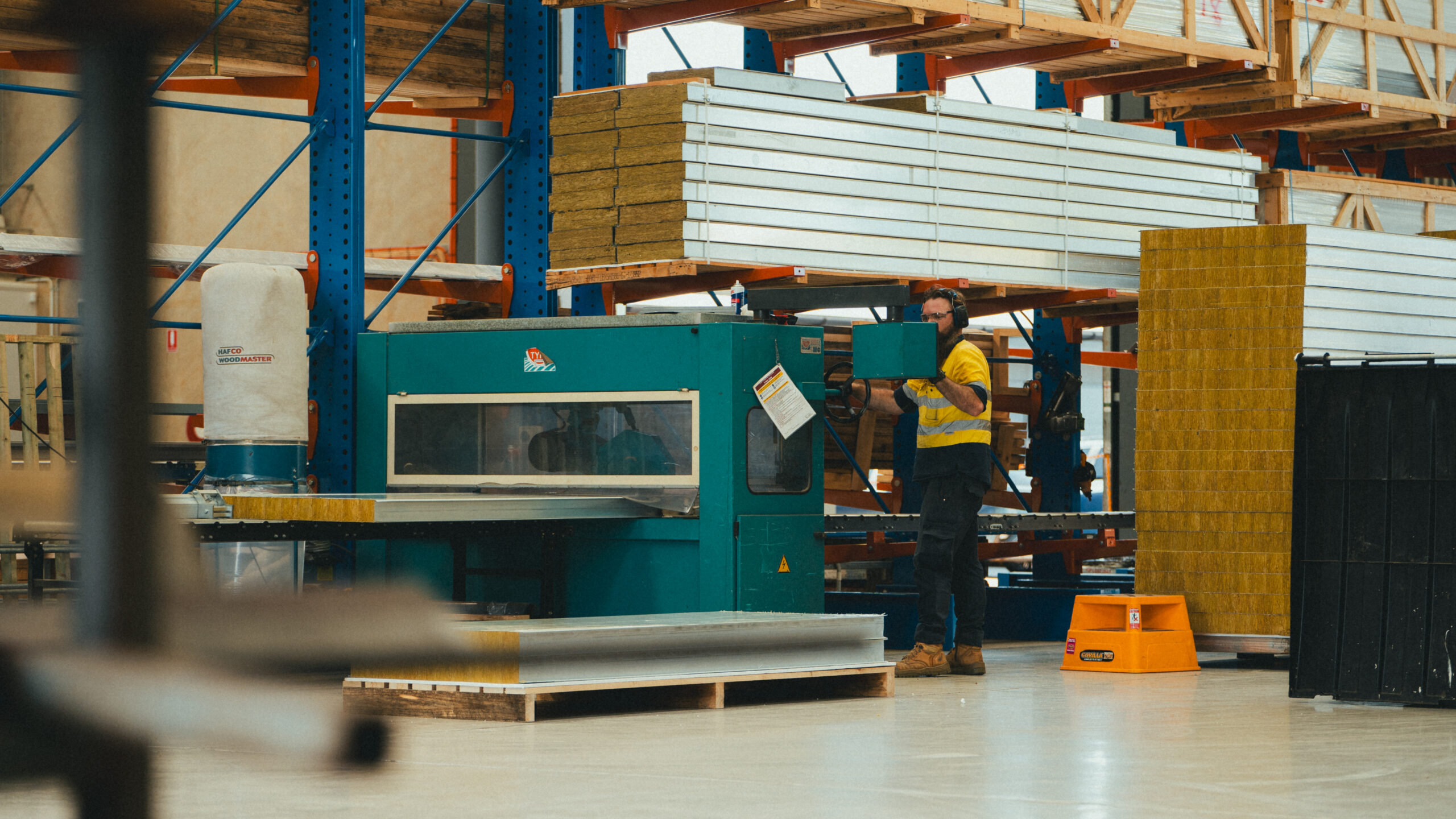 AcousTech staff member standing in the factory