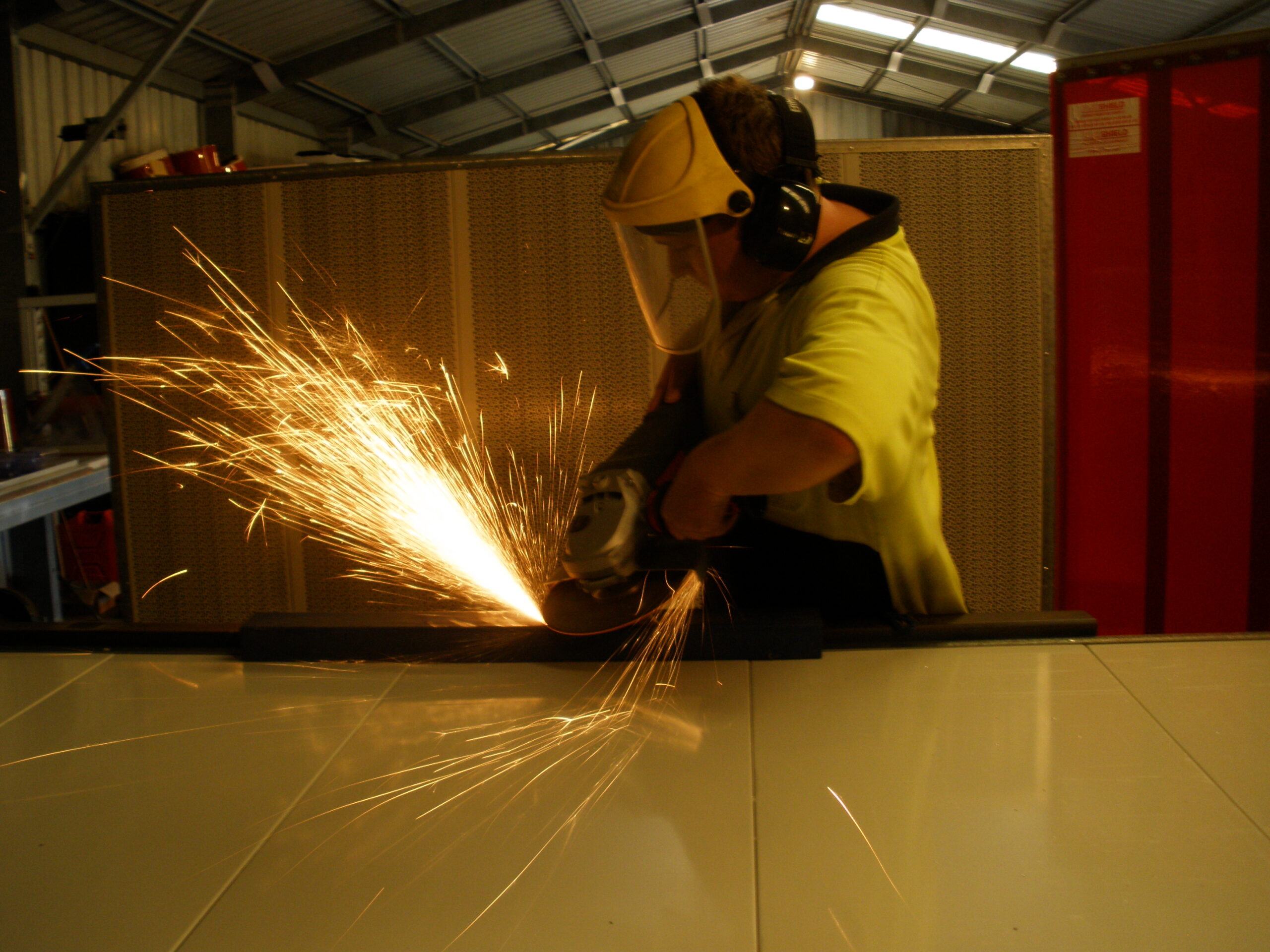 AcousTech employee working in front of noise control